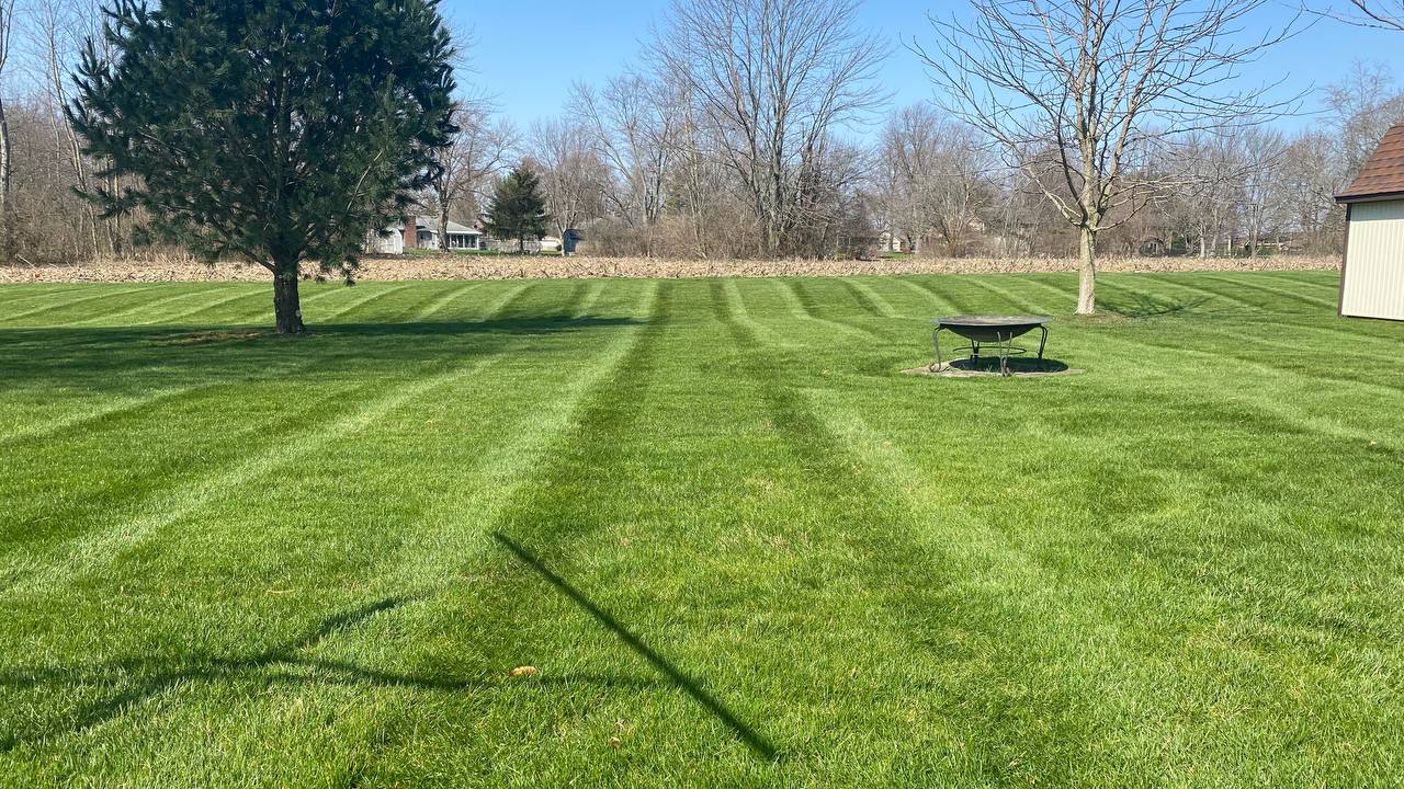 Striped Lawn with Fire Pit