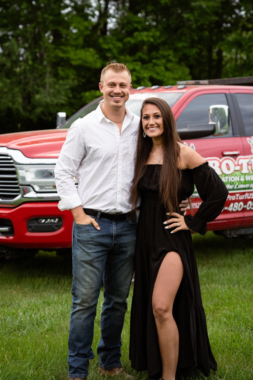 Pro-Turf founders standing in front of company truck